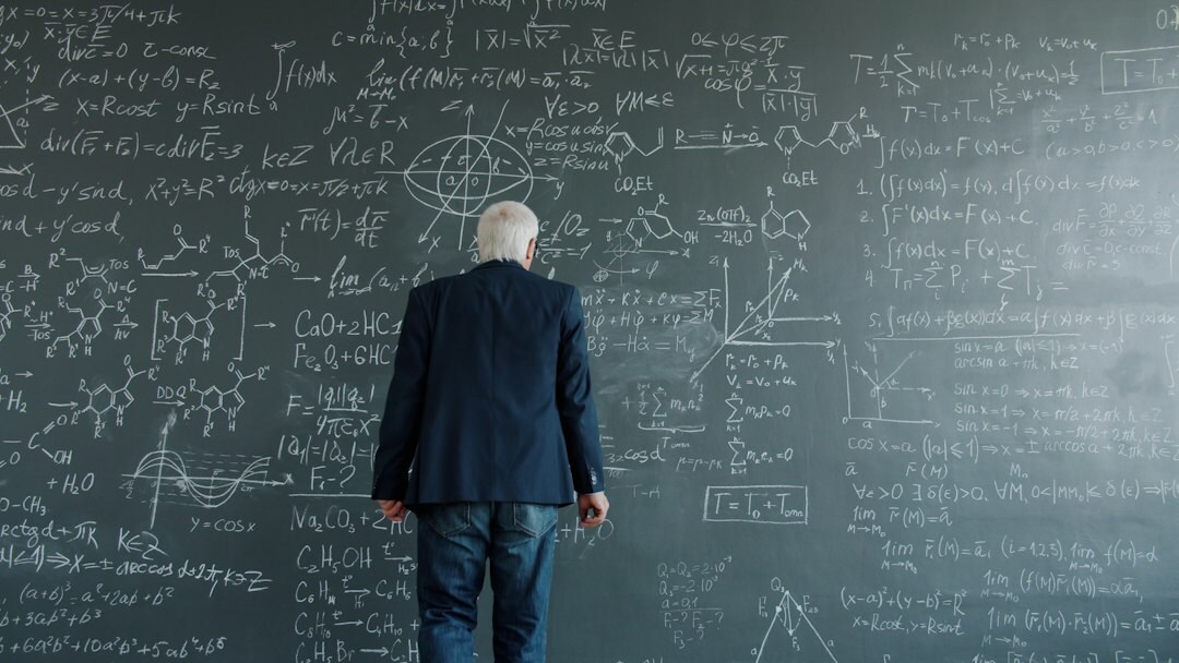scientist in lab with equations